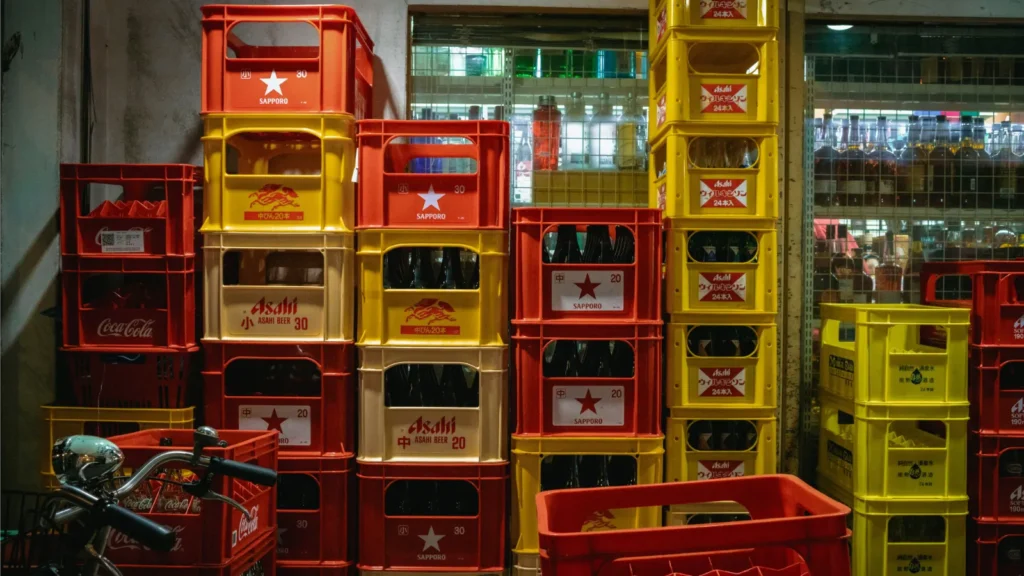 Stacked beverage crates in a restaurant supply area, showing a real-world example of drink storage, product organization, and inventory management in foodservice operations.
